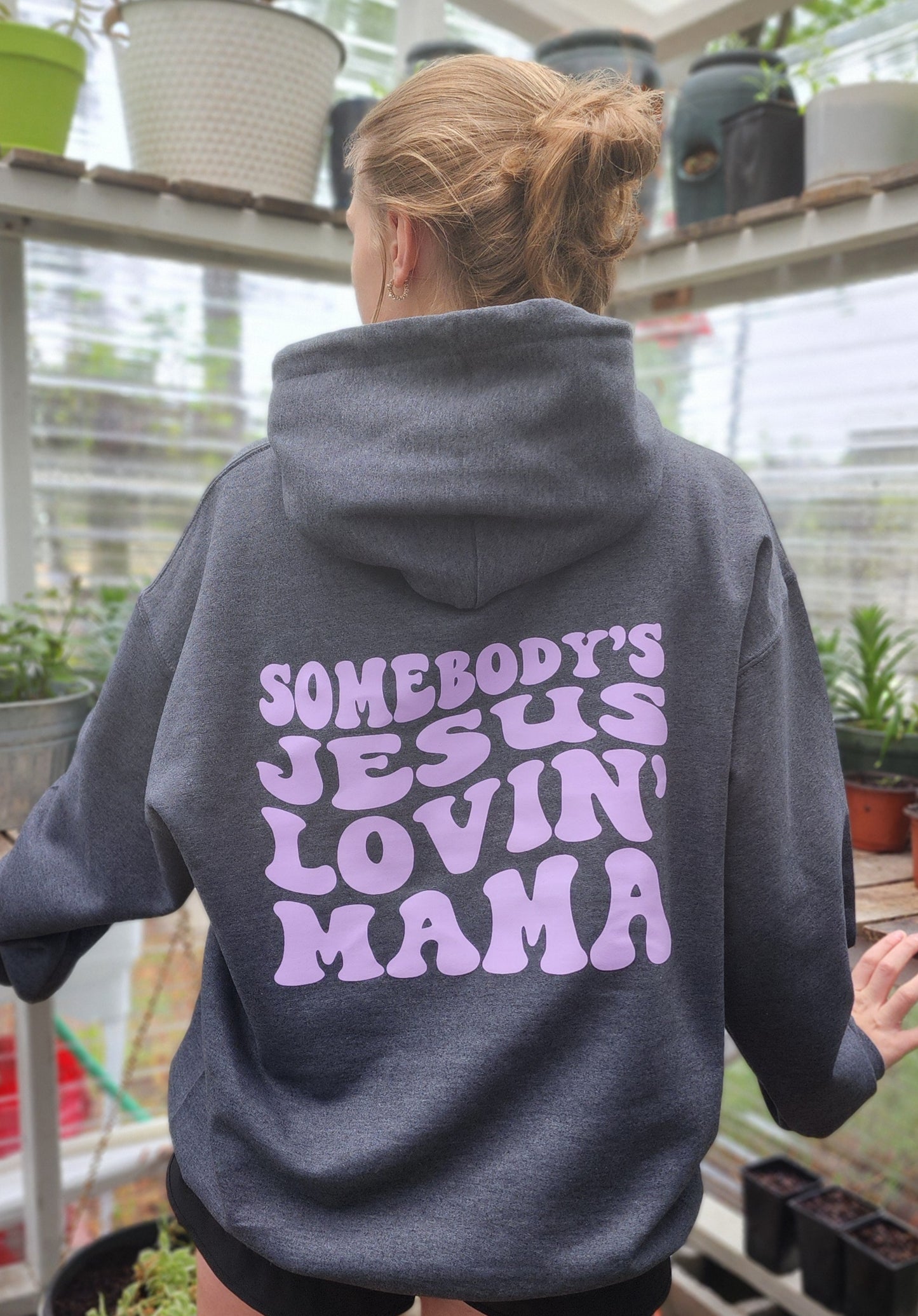 Dark grey Jesus Hoodie that says, Sombody's Jesus lovin' mama
