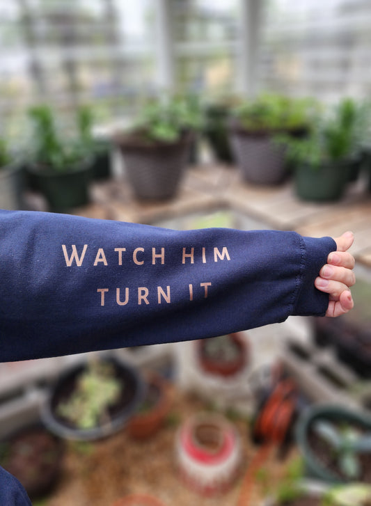 Blue Jesus Hoodie with Watch him turn it written on the sleeve